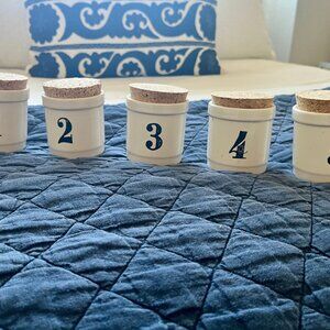 Anthropologie ceramic crocks with cork lids